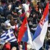 A Greek flag amidst Serbian flags during a mass Serbian protest rally in Belgrade over Kosovo.